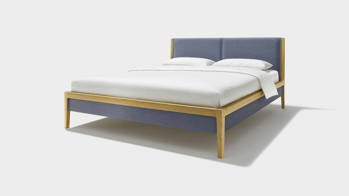 Solid wood bed with headboard and bed sides in fabric Solid wood bed with headboard and bed sides in fabric