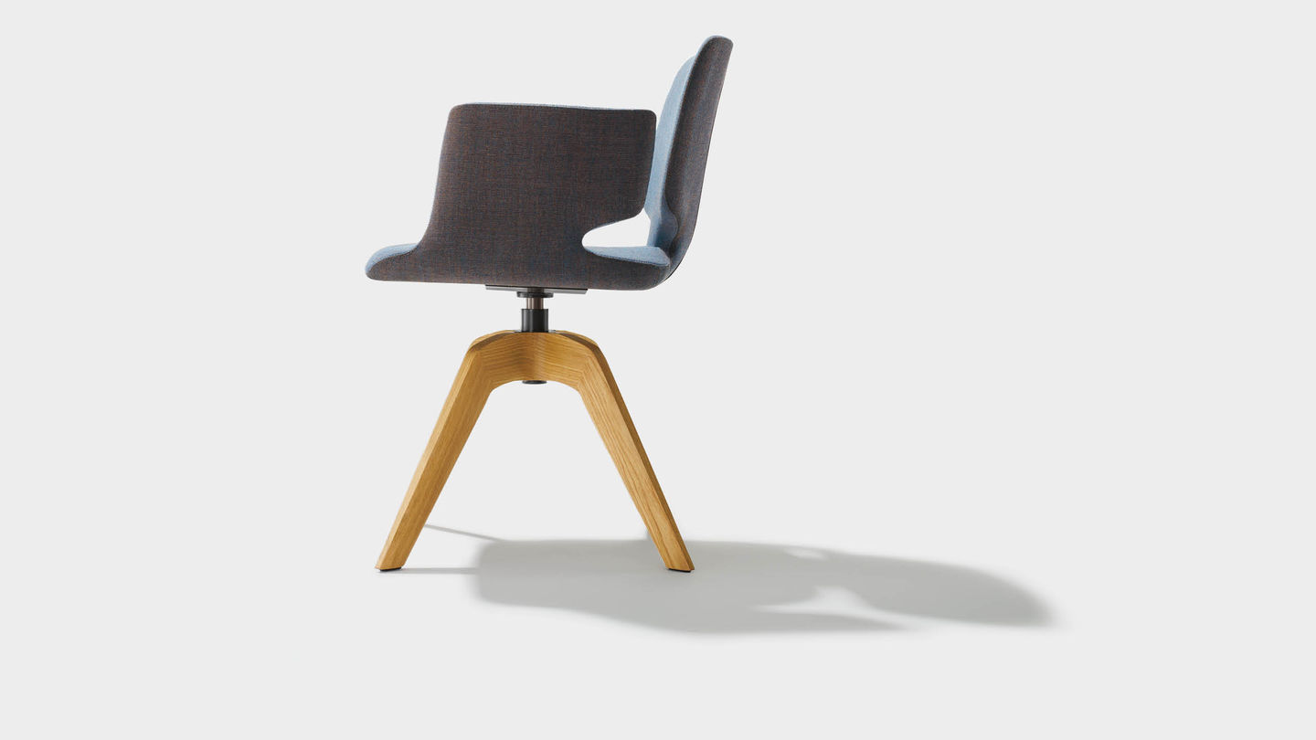 aye swivel chair in fabric with solid wood legs and armrests, from the side aye swivel chair in fabric with solid wood legs and armrests, from the side